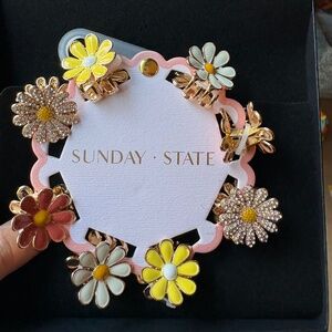 Colorful sparkly flower hair clips . NWT .